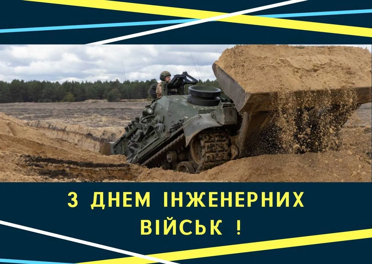 Інженерне танкове машини викопує землю на полі.